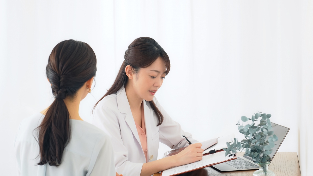What is hormone replacement therapy consultation between a doctor and patient reviewing lab results and a treatment plan